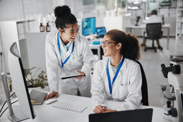istock Teamwork, technology and research in laboratory for analysis, innovation or experiment. Collaboration, professional and women in hospital for planning, advice or health care or medical career 2163767461