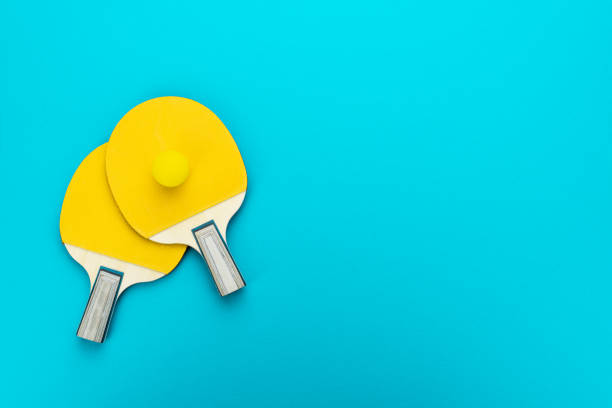 istock Flat lay image of two table tennis paddles with a ball 2163774576