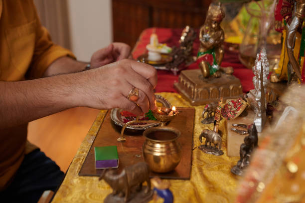 istock Man Lightning Candles At Altar 2163777443