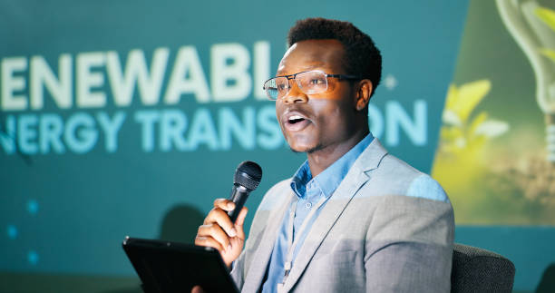 istock Black man, speaker and conference for climate change, presentation and seminar for renewable energy. African person, tablet and presenter with motivation for sustainability or eco friendly convention 2163778250