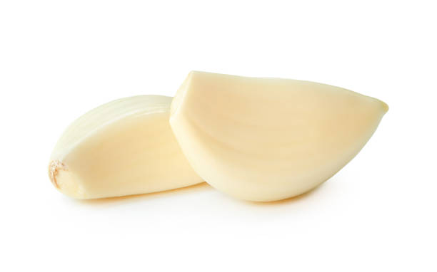 istock Front view of peeled white garlic cloves in stack isolated on white background with clipping path 2163783842