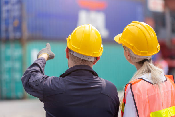 istock Customs worker team working in Port Cargo Shipping Container Yard together. 2163784231
