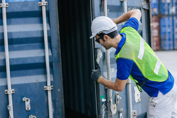 istock Port Authority team open look inside cargo goods container cabinet for safety according rule and Intermodal standard. 2163784317