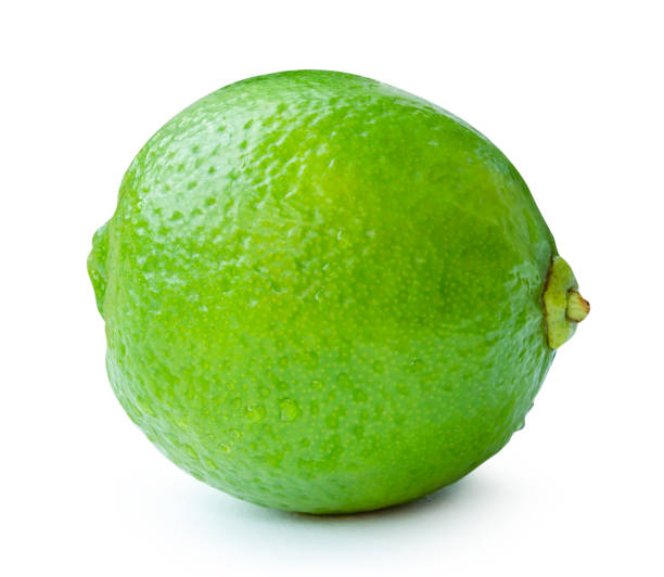 istock Side view of single fresh green lemon fruit with drops isolated on white background with clipping path 2163784704