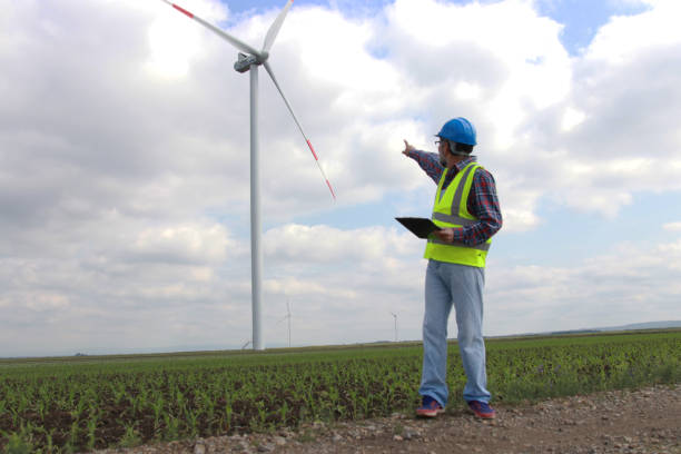 istock Industrial engineer in field windmills 2163788881