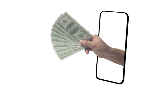 istock Hand holding dollar bills extending from phone screen, online banking, cryptocurrency, making money, online shopping 2163790995