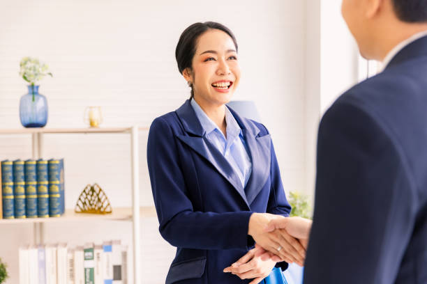 istock Financial advisor talking to female client in modern office. 2163795974