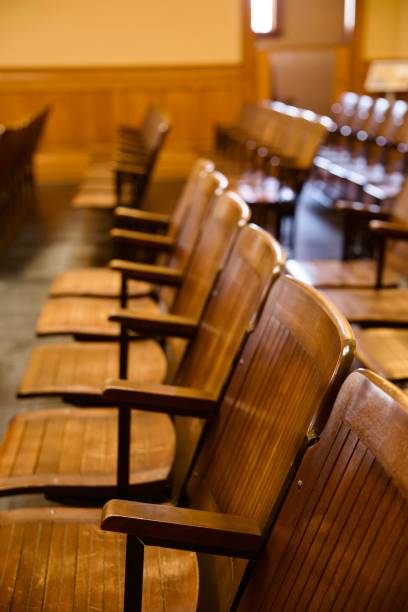 istock Folding wood spectator seats in the old courthouse 2163797036