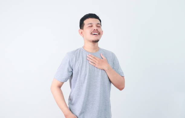 istock a young asian man was holding his chest and feeling relieved 2163800015