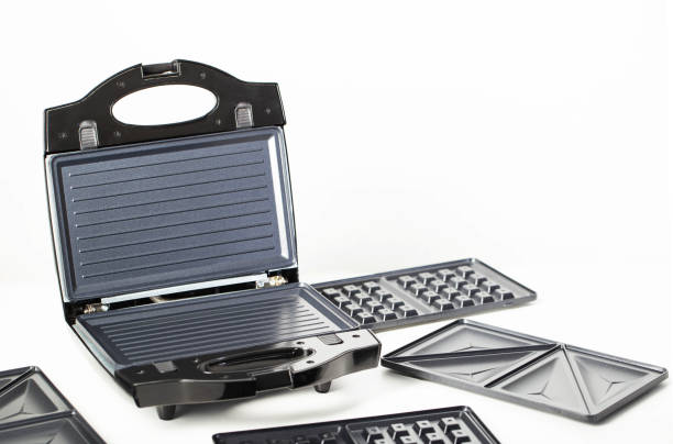 istock Sandwich maker with baking dishes on a white background, isolate, close-up. Copy space for text 2163800990