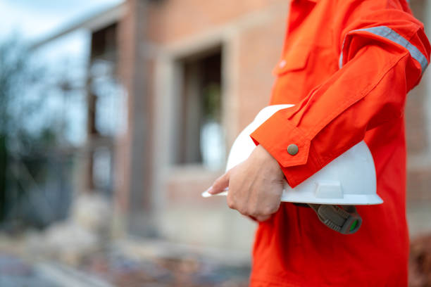 istock A construciton foreman with safety helmet at construction site. 2163804697