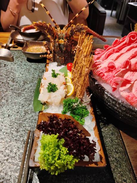 istock Beef in hot pot and Lobster Sashimi 2163805341