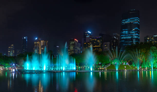 A picture of the KLCC Park water and light fountain show at night.