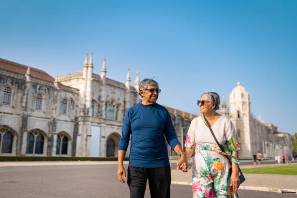 istock Elderly couple holding hands in Lisbon 2163807864