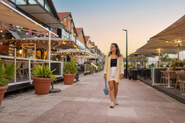istock Woman walking at the Santo Amaro Docks 2163807942