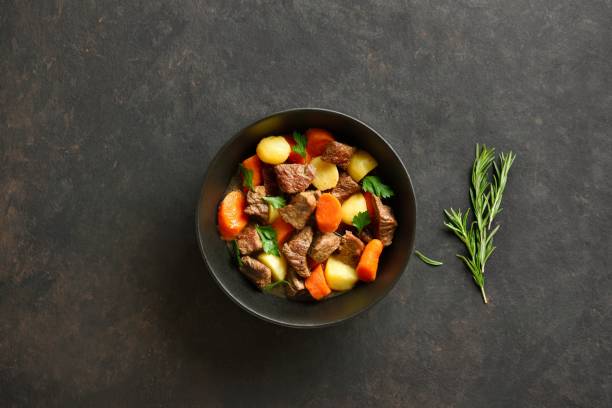 istock Beef stew with potatoes, carrots and greens 2163808732