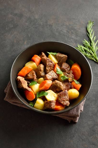 istock Beef stew with potatoes, carrots and greens 2163808735