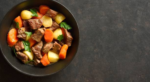 istock Beef stew with potatoes, carrots and greens 2163808748