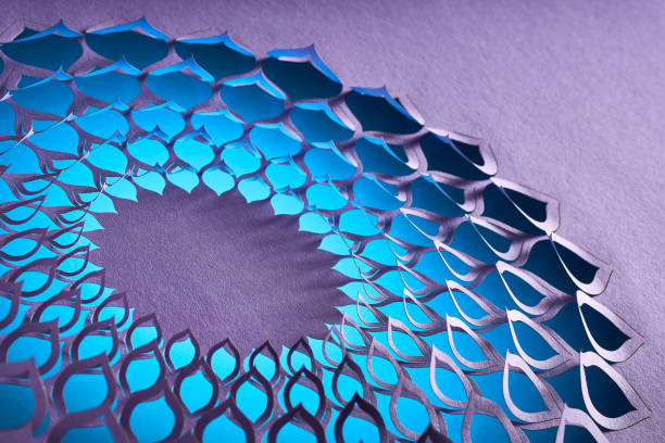 istock Abstract geometric paper art with intricate blue cut-out pattern on a purple textured background 2163811214