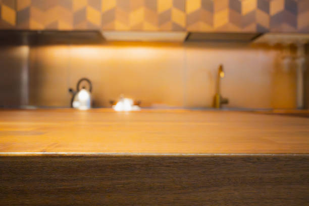 Wood table with blur kitchen room background .For montage product display or design key visual layout.