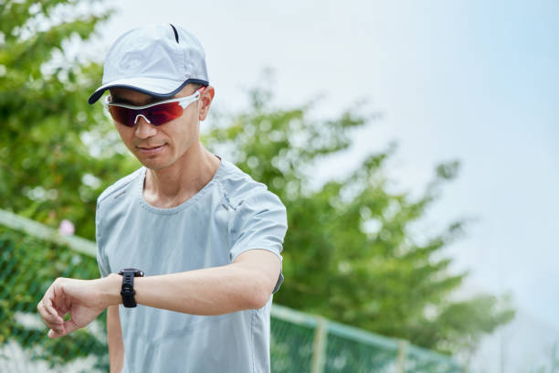 Man running in the park wearing a smartwatch