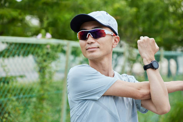 istock Man running in the park wearing a smartwatch 2163812196