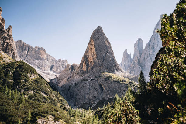 istock Sunrise over mountain peaks and forest 2163818871
