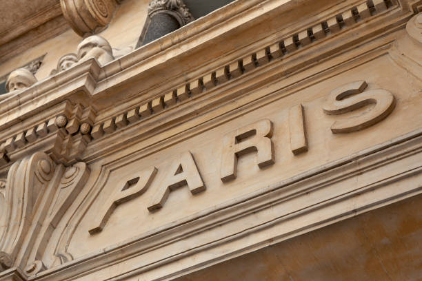 istock French capital name on a stone wall 2163819312