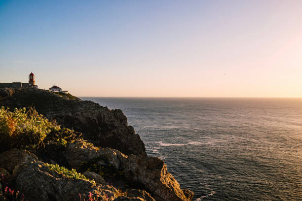 Lighthouse on headland above ocean, Sagres