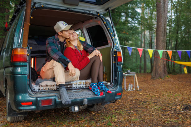 istock Couple Unwinding Inside Van in Quiet Forest Environment 2163826756