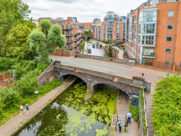 Birmingham, UK. 24 July 2024. People on canal footpath in Birmingham
