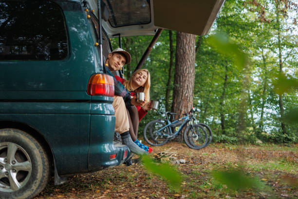 istock Young Couple Enjoying Tea in Scenic Van 2163827754