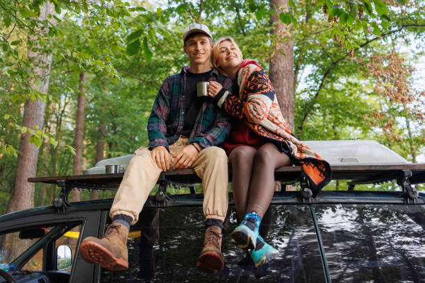 istock Young Couple Relaxing with Tea on Van Top 2163828451