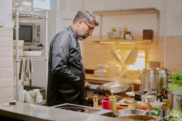 istock Famous Chef Serving Food 2163829428