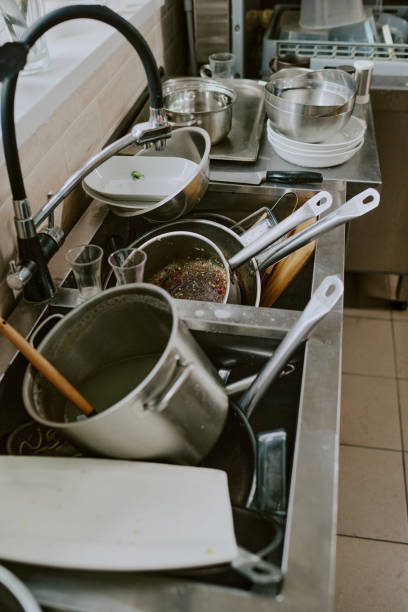 istock Heap of Crockery in Kitchen Sink 2163829638