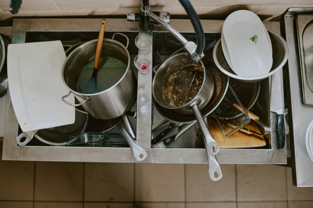 istock Dirty Crockery in Sink 2163829657