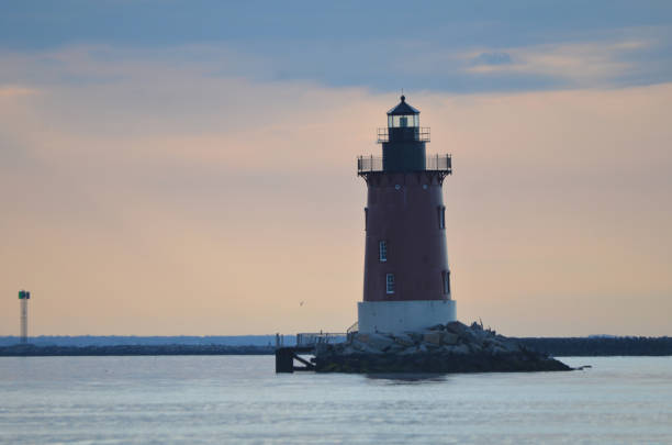 istock Delaware Breakwater Lighthouse at Cape Henlopen State Park at sunset 2163836545