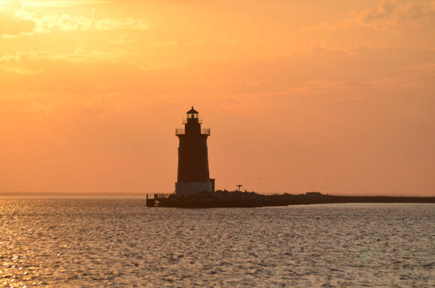 istock Delaware Breakwater Lighthouse at Cape Henlopen State Park at sunset 2163836588