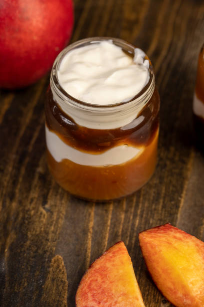 istock fresh yogurt with jam and pieces of ripe nectarine 2163838378
