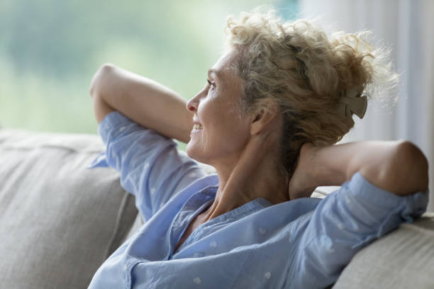 istock Close up side view mature peaceful woman relaxing on sofa 2163840726