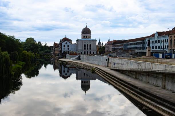 Oradea, Romania, July, 13, 2023.  Neolog Synagogue Sion reflected in Crisu Repede river