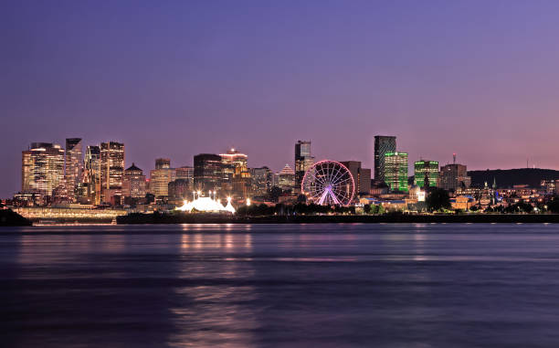 istock Montreal illuminated new skyline, including recently added skyscrapers, reflected in the St. Lawrence River at dusk, Quebec 2163844407