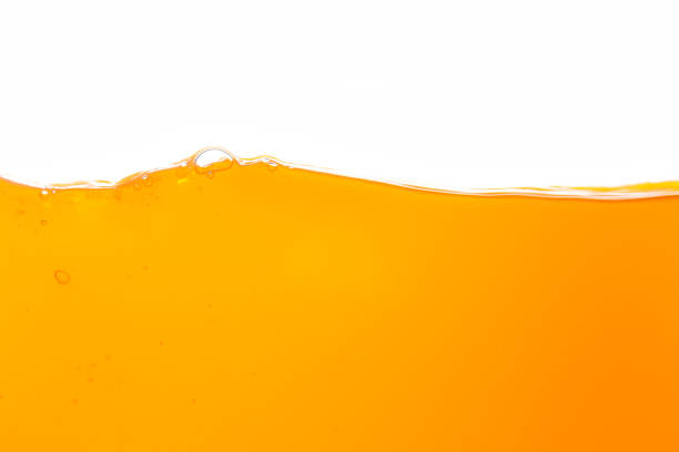 Orange juice isolated white background,orange juice texture on white background,Close up bright orange juice texture for health and nature waves