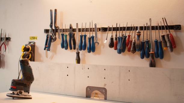 istock Close up of various woodworking tools on rack, panning shot 2163846071