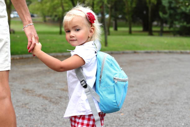 istock Little girl with backpack going to school, study concept 2163847595