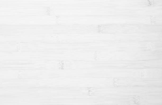 istock White wooden desk texture background, Top view. Abstract top bar table wood bamboo pattern nature. Design wall vintage interior kitchen. Bamboo skin cutting board empty for displaying products. 2163849963