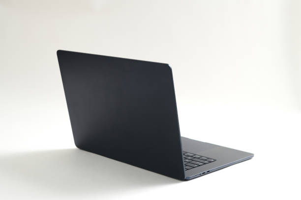 istock Side view of laptop with blank screen isolated on white background. Selective focus. 2163860314