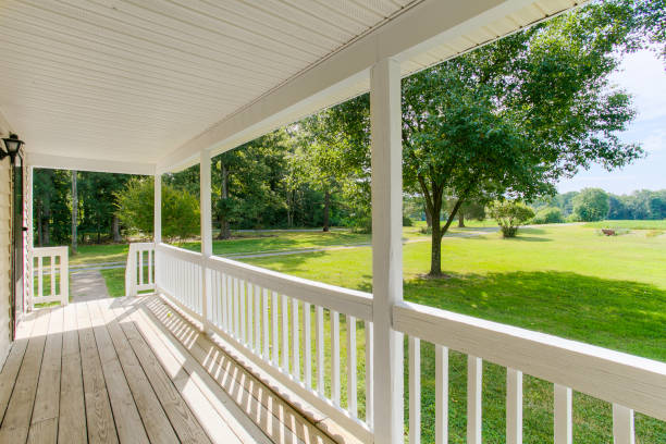 istock Charming Front Porch With Expansive Yard View And White Railing For Sale. 2163860719
