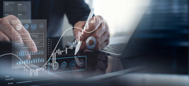 istock Businessman using tablet analyzing sales data and financial report, business growth graph chart. digital marketing planning and strategy, financial report, business, finance and investment concept 2163861615