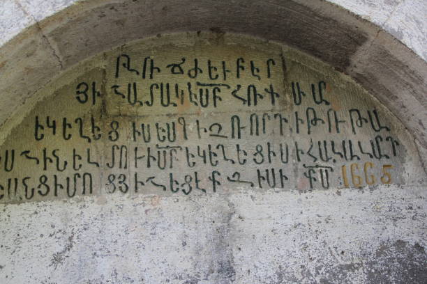 istock Ancient stone monument with intricate carvings and weathered inscriptions 2163865425